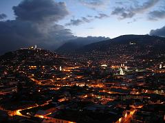 Ecuador Quito 07-05 Old Quito Cafe Mosaico Sunset View Of El Panecillo And Old Quito We had dinner at Cafe Mosaico in an old house high up on a hill overlooking Old Quito. The view from Cafe Mosaico is excellent. Here is a view of Old Quito and El Panecillo just after dusk as the lights came on.